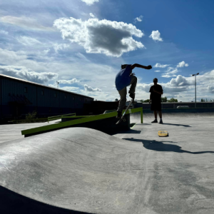 Kids using the skate park in the early evening