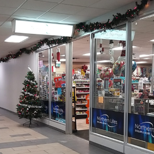 Exterior of the shop from within the mall at Christmas time.