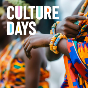 African woman in colourful traditional wear with a close-up of hands