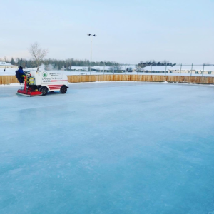 Zambone cleaning the ice on the outdoor rink
