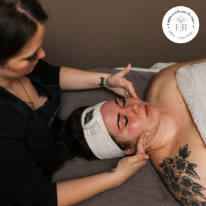 Haley giving a woman a relaxing facial.